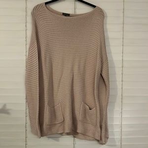 Long sweater with front pockets
